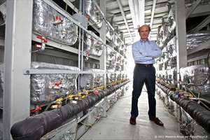 Italian engineer Rossi staind inside one of his megawatt cold fusion power plants like one now online powering a US coprporation commercial production line.